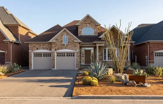 A home landscaped in the Desert Xeriscape style by Landscape AI