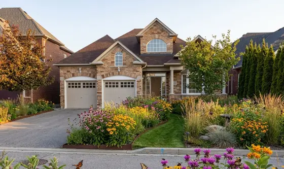 A home landscaped in the Pollinator Meadow style by Landscape AI